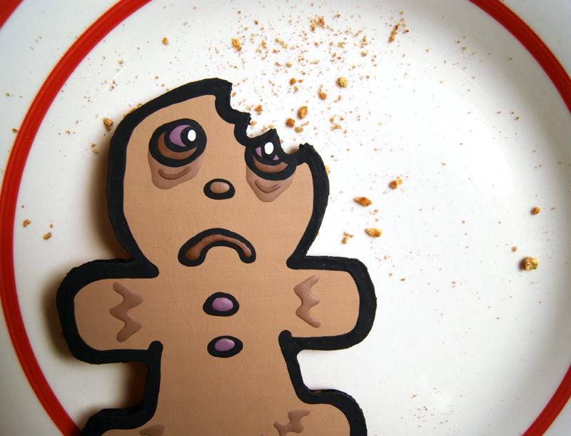 cardboard gingerbread with a bite taken out of it