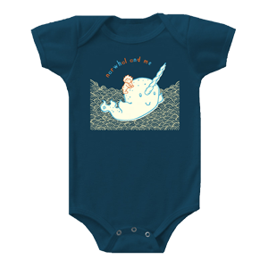 boy riding a narwhal print on a onesie